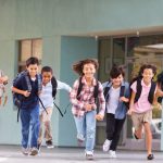 group-of-elementary-school-kids-running-in-a-P6NVUWX-1024×683