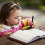 Optimized-cute-little-girl-learning-to-write-PDQRKMH-min