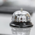 Support and service bell in hotel on blurred background.